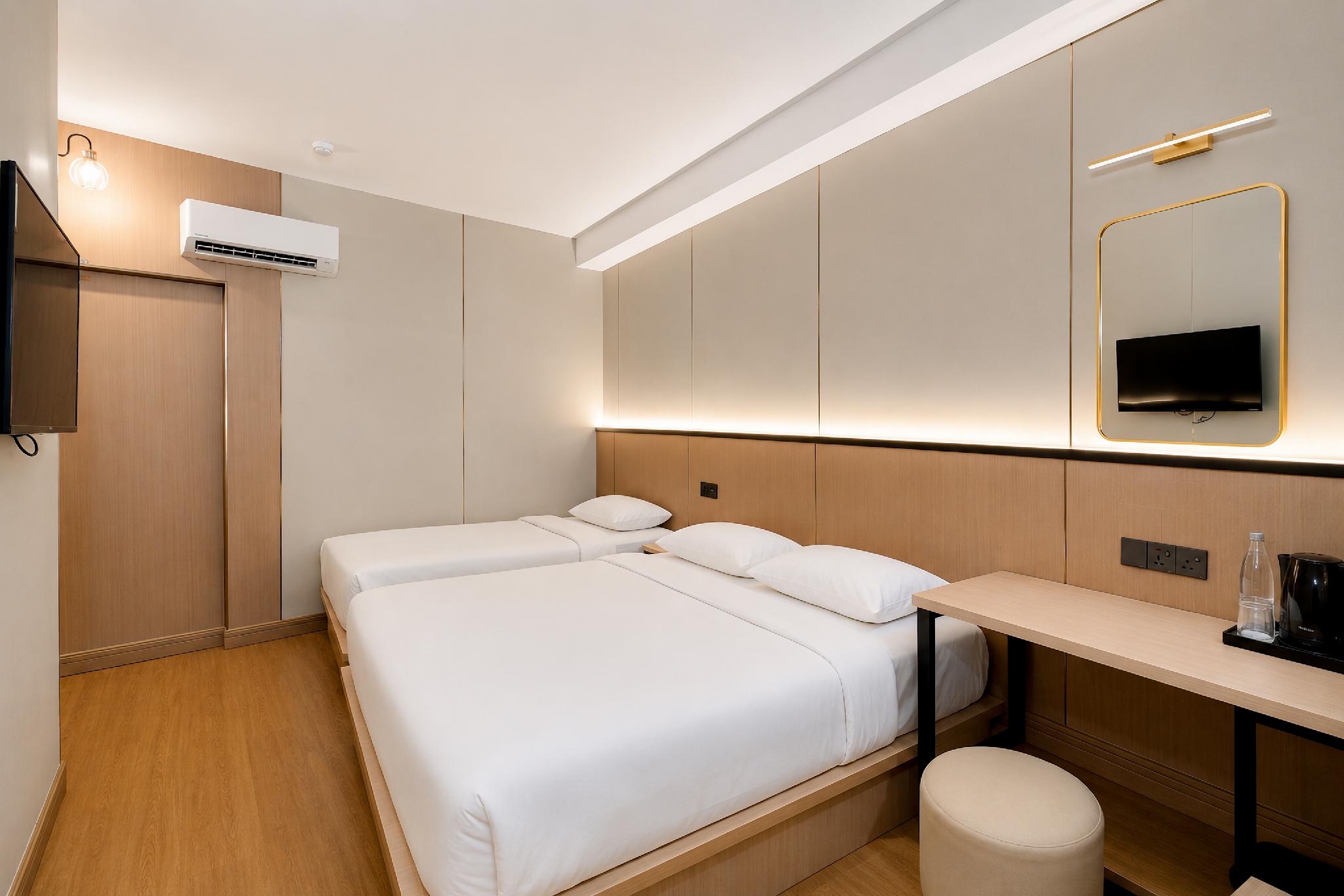 غرفة بريميوم ثلاثية بسرير كوين وسرير فردي، Ming Paragon Hotel 2/2