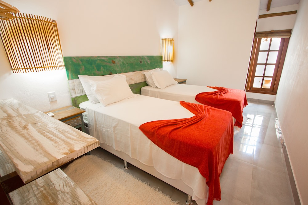 غرفة ديلوكس رباعية بسرير مزدوج وسريرين منفصلين، Rio Da Barra Villa Hotel 1/2