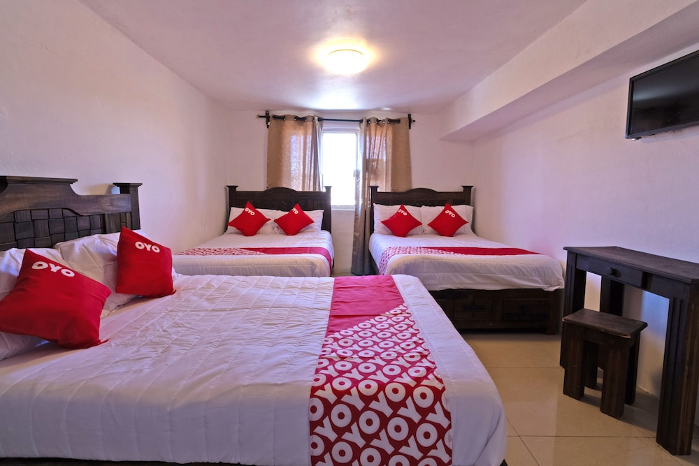 غرفة قياسية رباعية بسريرين مزدوجين، OYO Hotel Punta Guadalupe, San Cristobal de las Casas 3/3