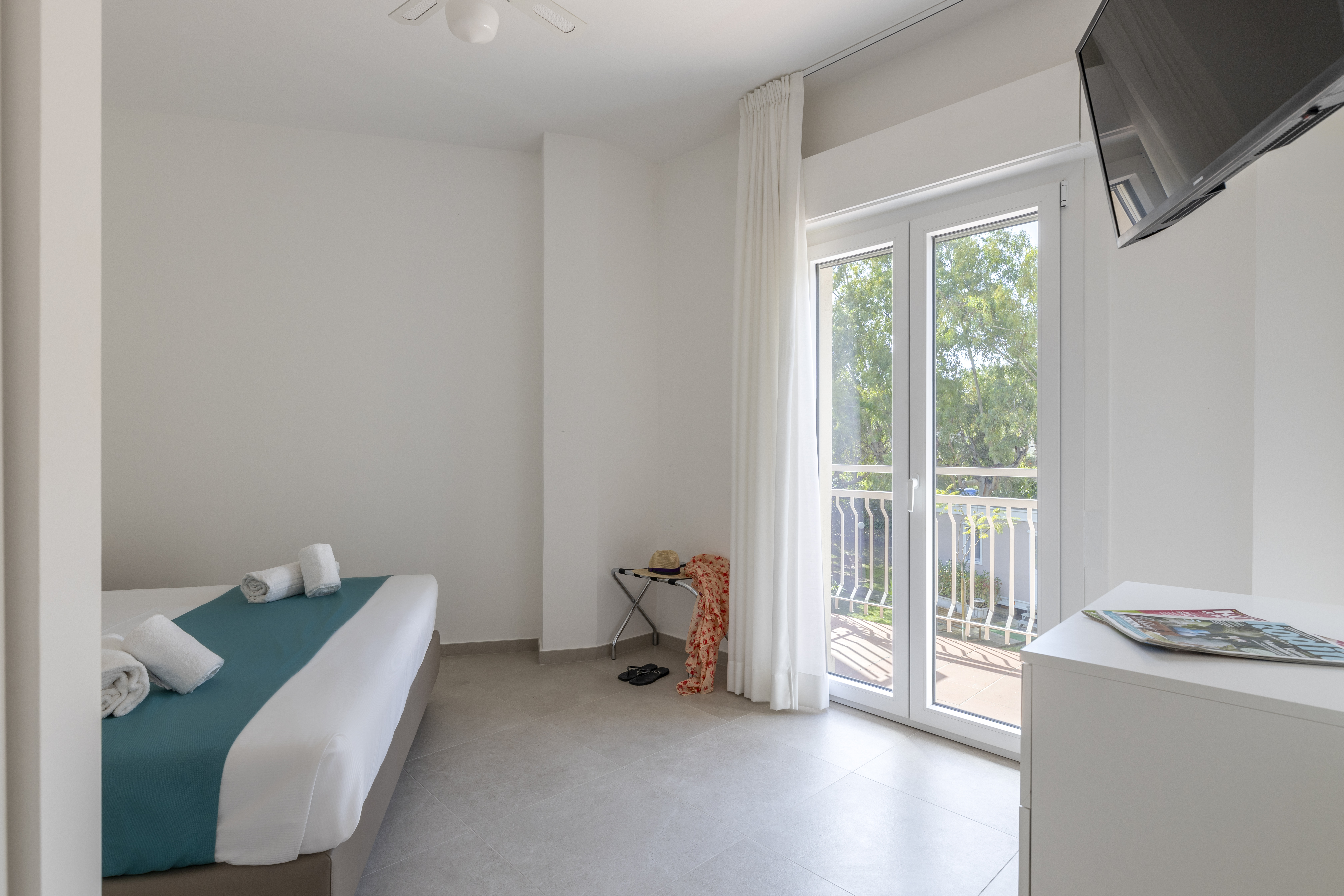 غرفة بأربعة أسرّة بإطلالة على الحديقة بشرفة بغرفتين، Residence Villa Giardini 4/5
