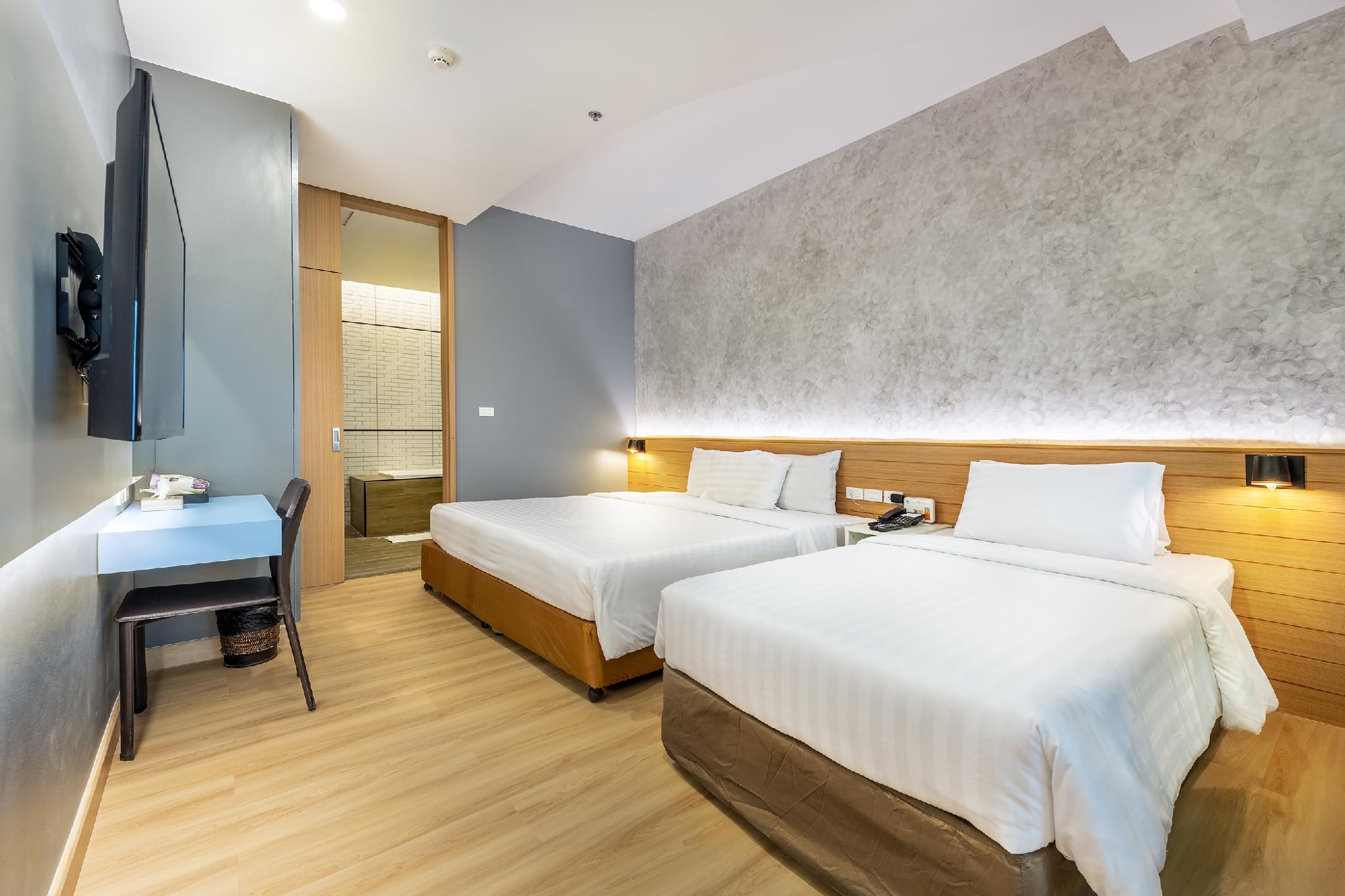 جناح بسرير كينج وسرير فردي بغرفة نوم واحدة