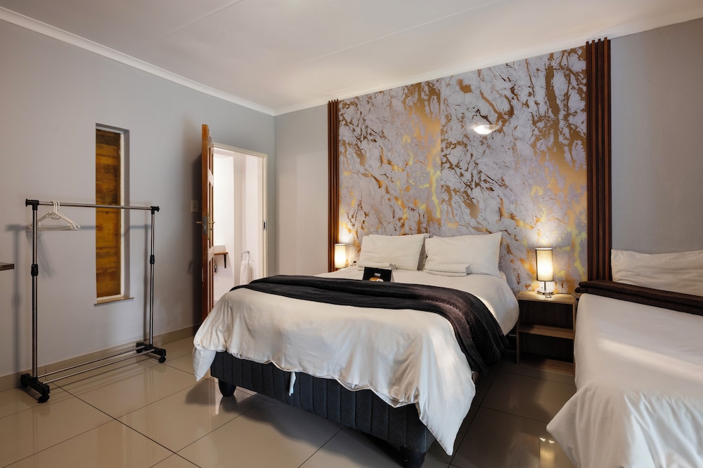 شقة عائلية بسرير كوين وسرير فردي بغرفة نوم واحدة، Menlyn Apartments 5/10