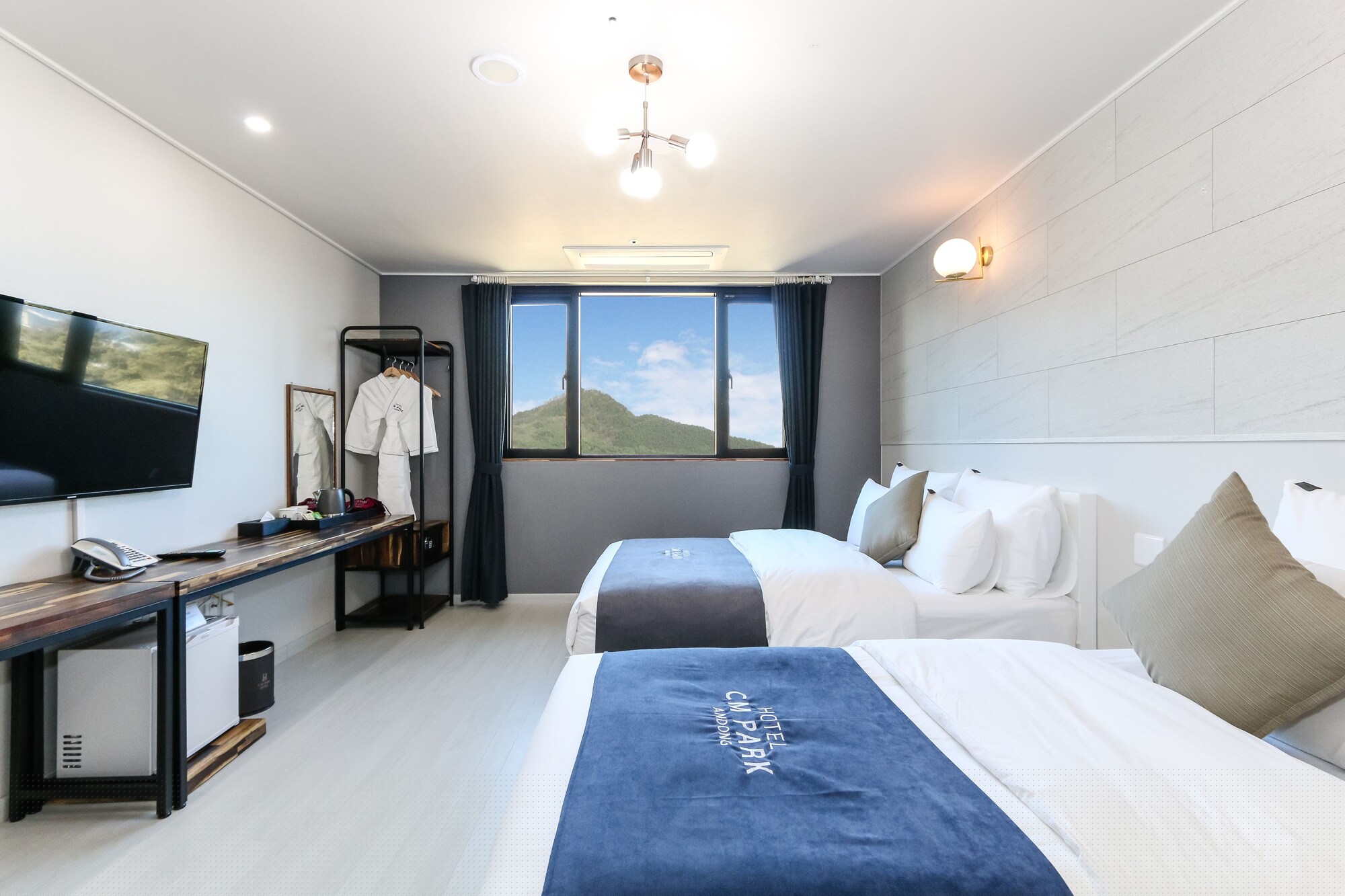 Deluxe, Triple, 1 Single and 2 Double Beds