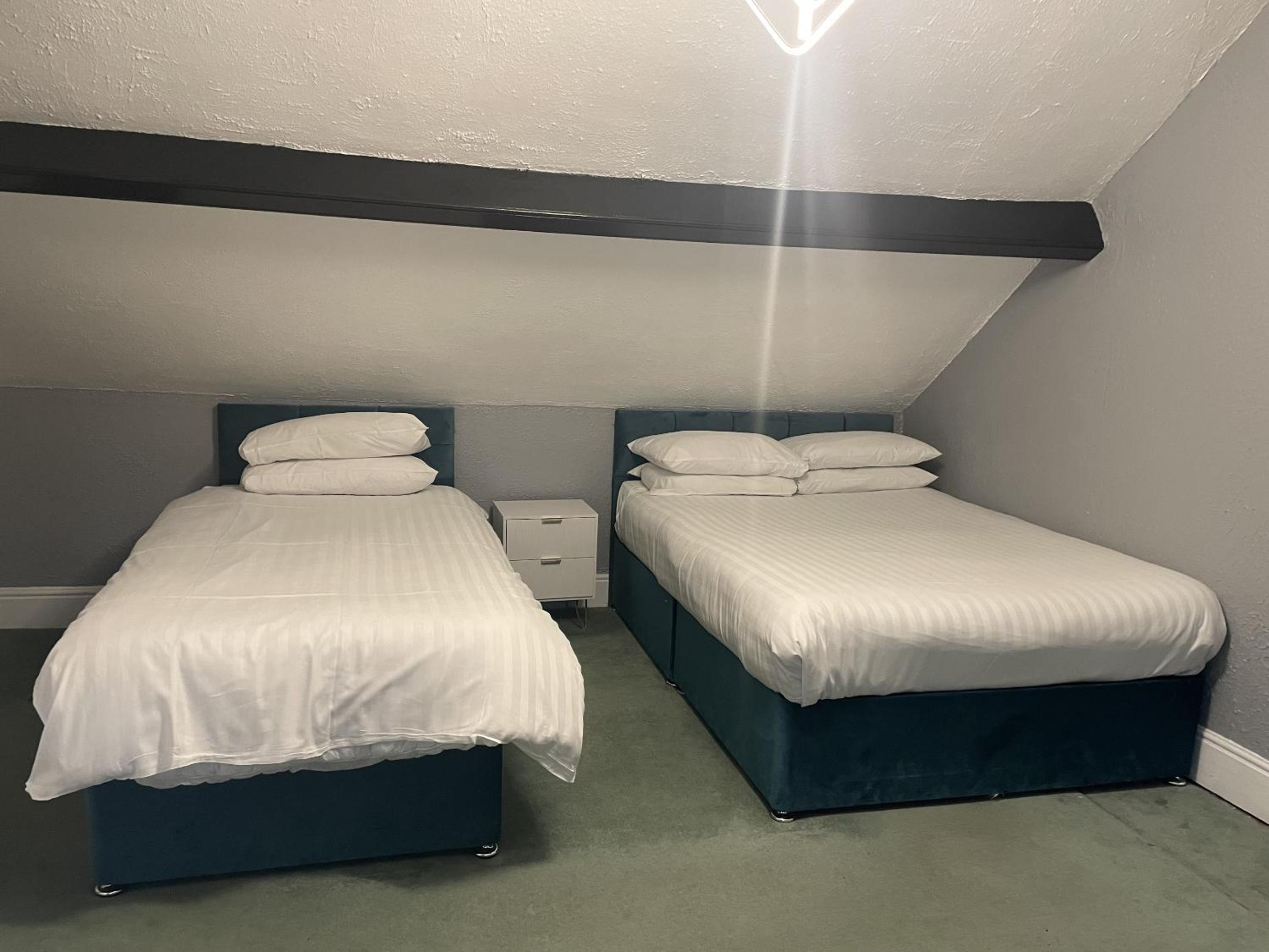 Basic, Triple, 1 Double and 1 Single Bed, Shared Bathroom