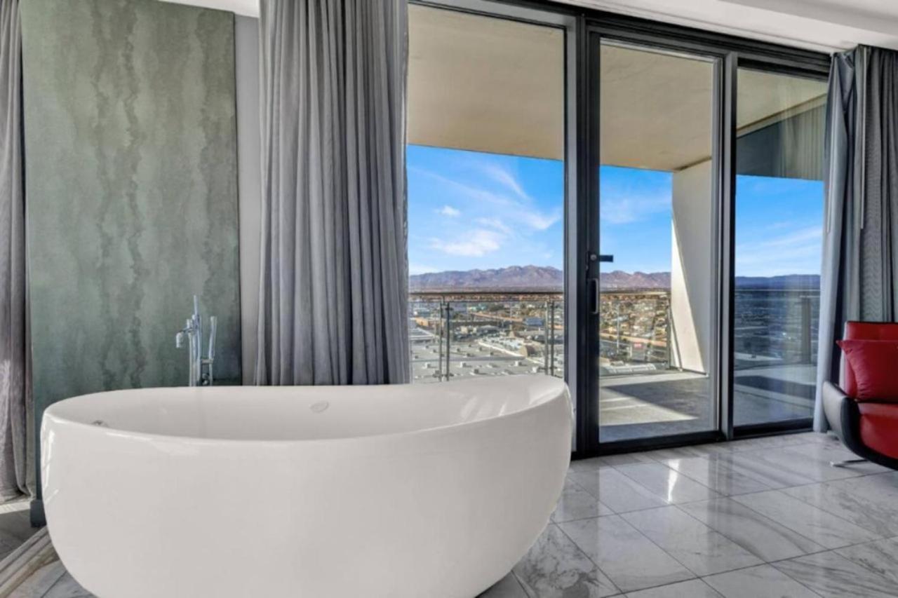 1 Bedroom Balcony Collection Living Room & Jet Tub Bath - StripSuite Palms Place Hotel 17/31