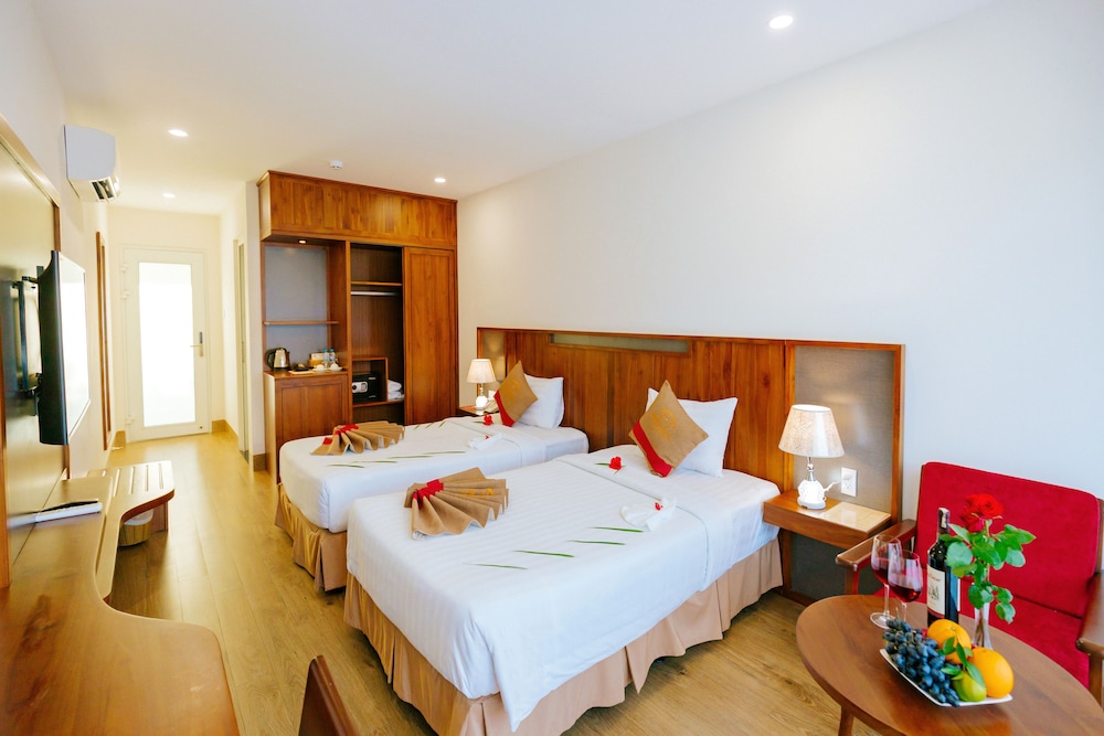 غرفة ديلوكس بسريرين منفصلين بإطلالة على الحديقة، Le Aqua Resort & Spa Phan Thiet 4/8