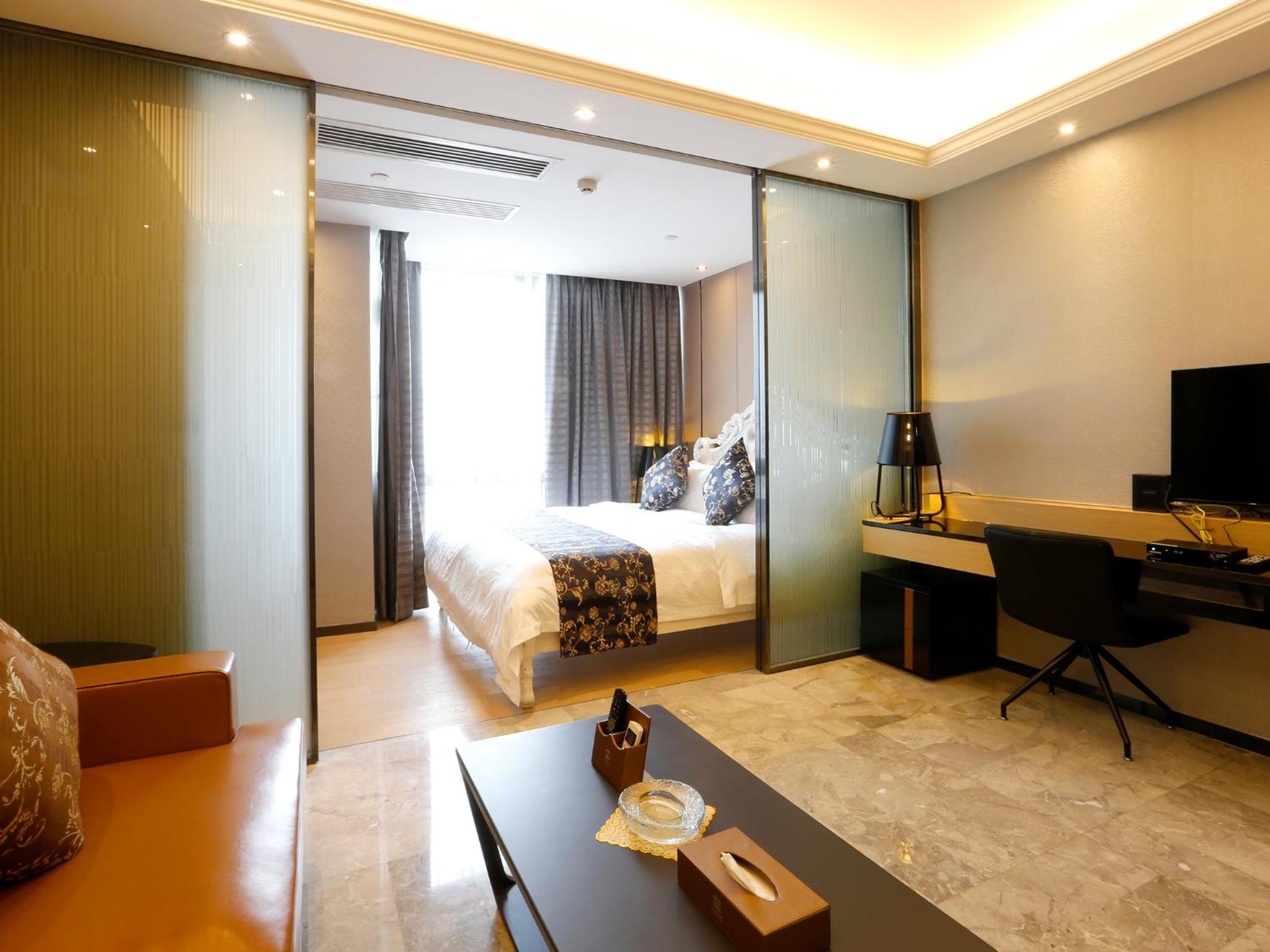 جناح تنفيذي بسرير كينج بغرفة نوم واحدة، Pengman International Apartment Hotel (Beijing Road Jiedeng Duhui) 9/10