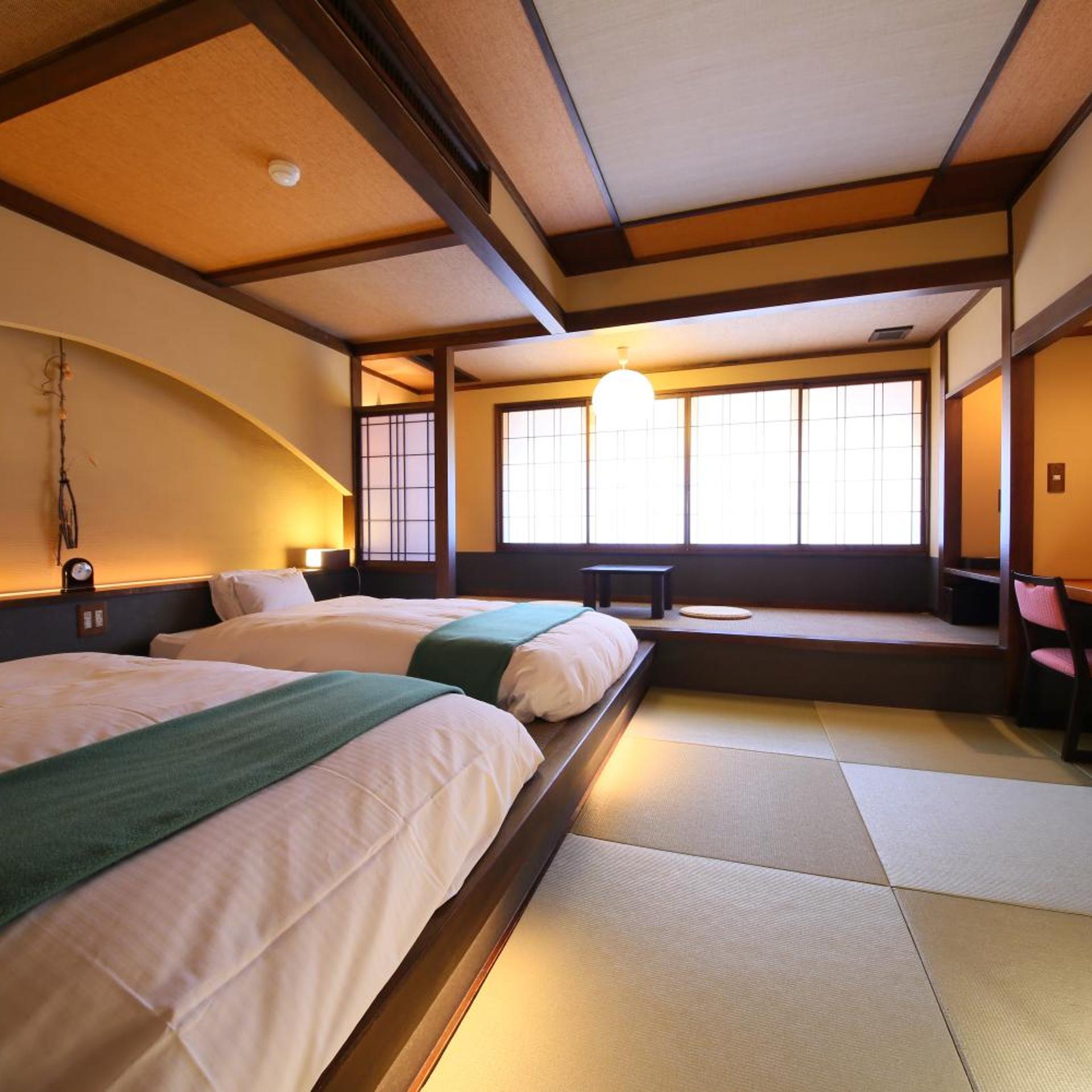 غرفة بسريرين منفصلين بأرضية تاتامي، Hotel Tamanoyu 3/10