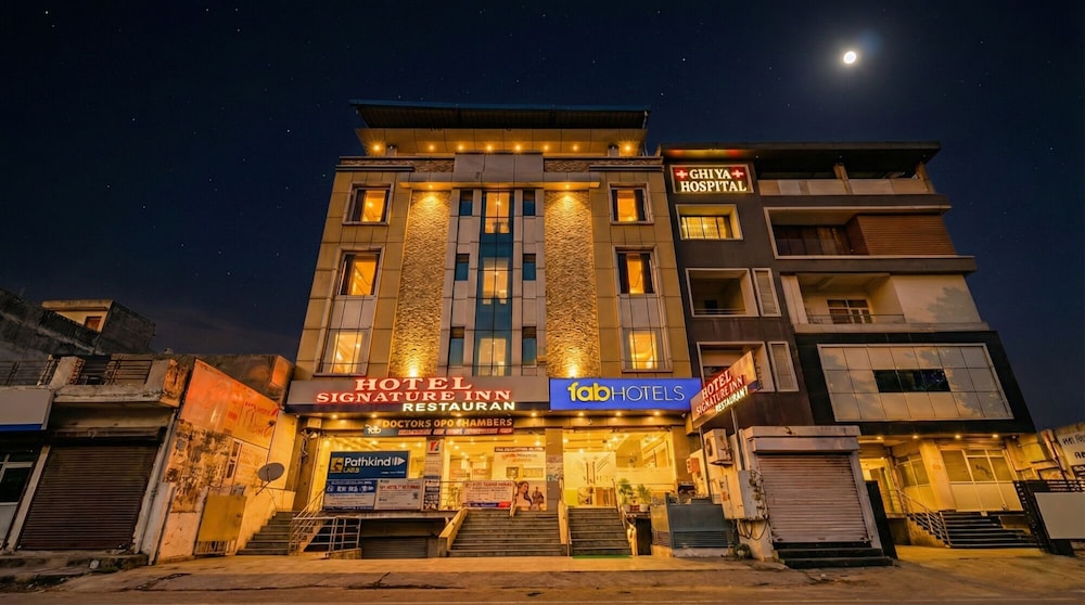Fabhotel Signature Inn 1/50