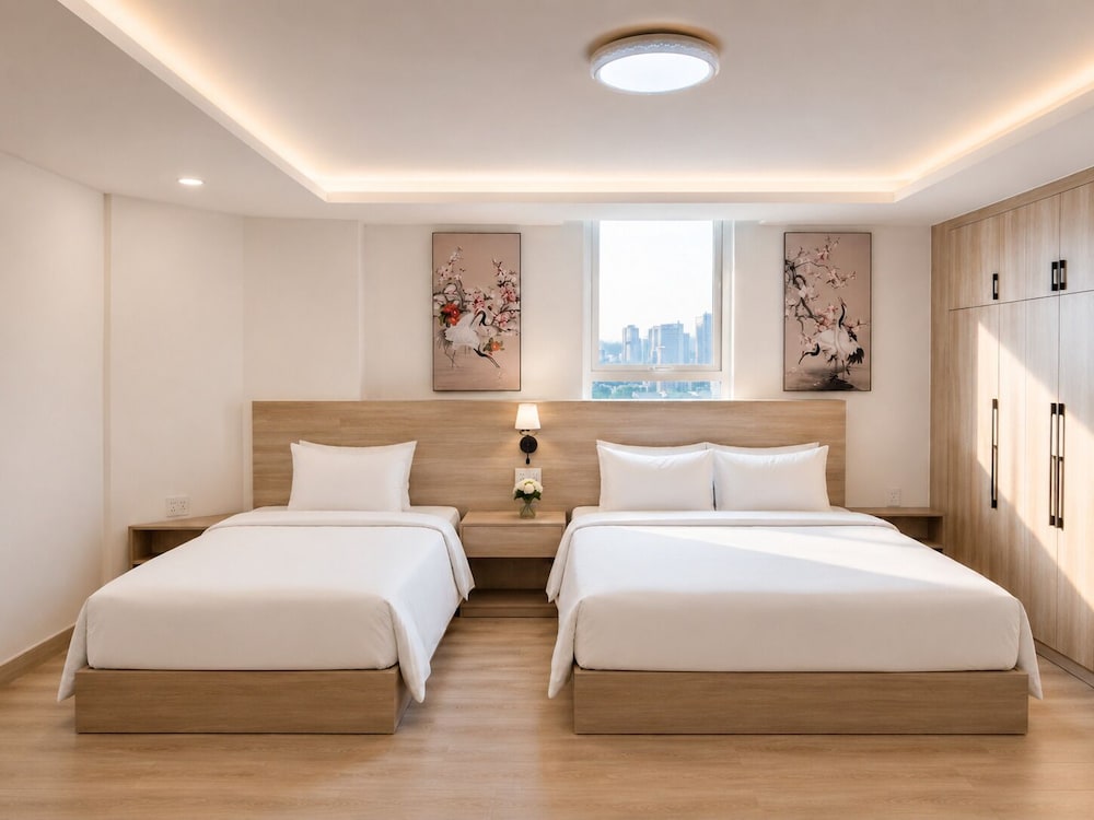 غرفة ديلوكس ثلاثية بسرير مزدوج وسرير فردي بإطلالة على المدينة، G8 Center Hotel Saigon 9/10