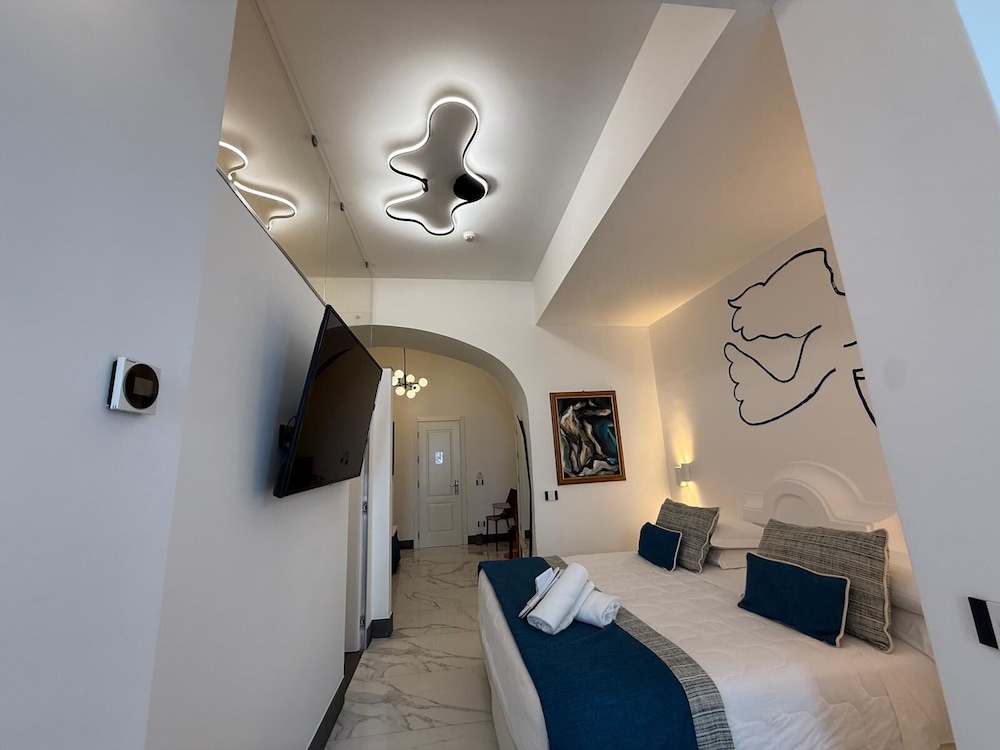 غرفة جونيور بسرير مزدوج وسريرين منفصلين، Positano Art Hotel Pasitea 10/10