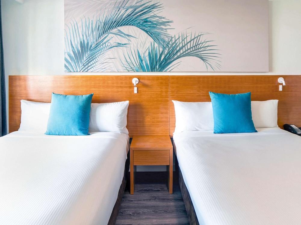 غرفة قياسية بسريرين مزدوجين بإطلالة على المسبح، Novotel Cairns Oasis Resort 5/9