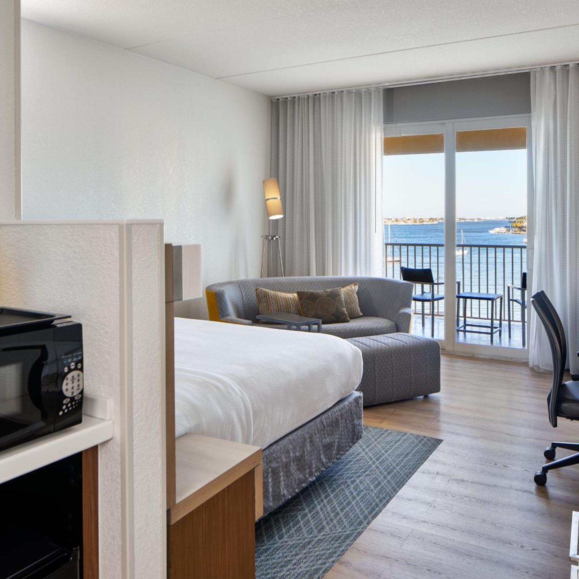 Room, King Bed, Partial Water View, Sofa, Balcony