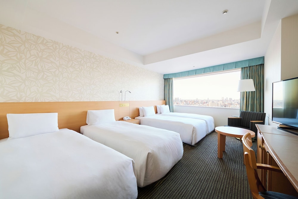 غرفة رباعية بأربعة أسرّة