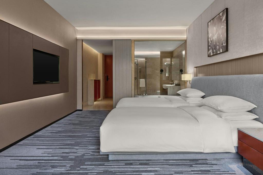 غرفة ديلوكس بسريرين منفصلين بإطلالة على المدينة، Dongguan Forum Hotel and Apartment 3/9