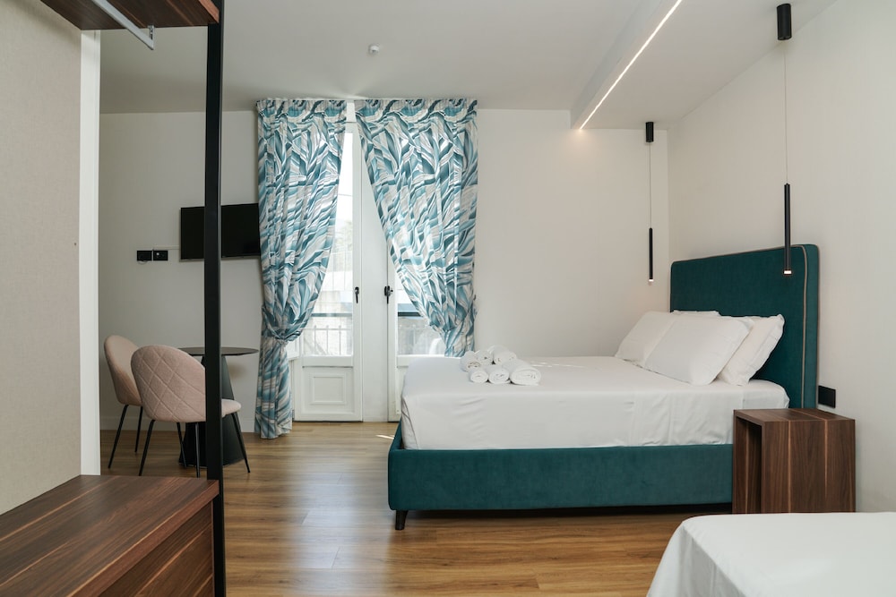 DELUXE, TRIPLE, 1 DOUBLE AND 1 SINGLE BED