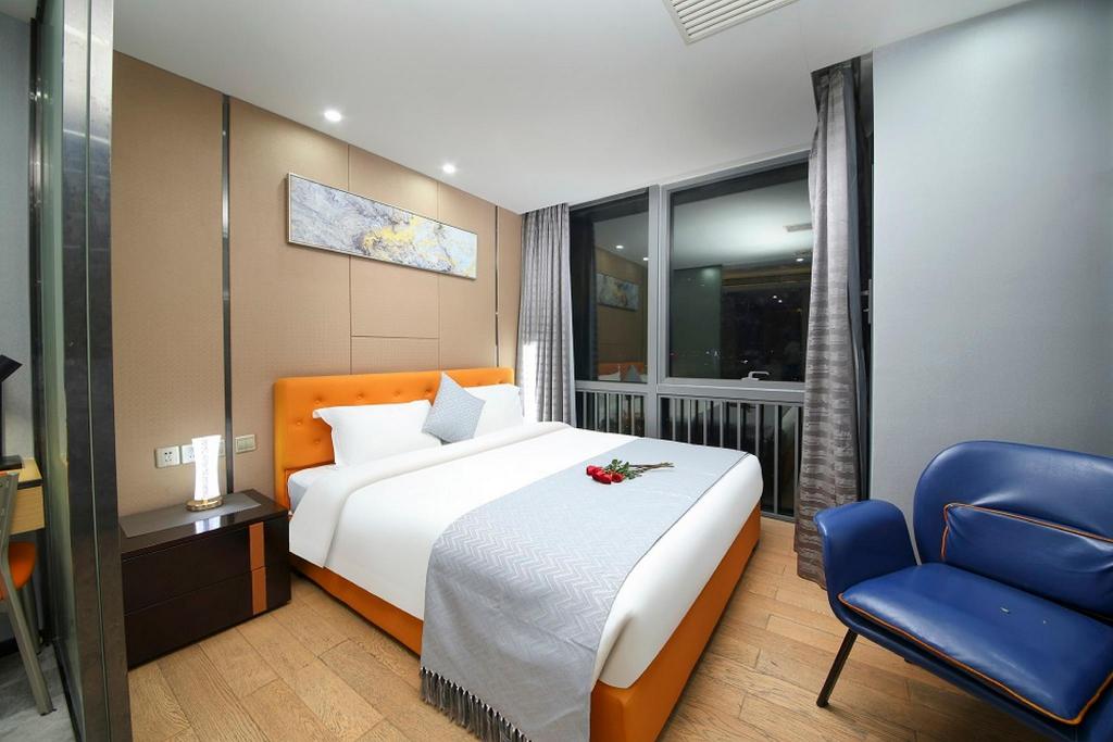 جناح تنفيذي بسرير كينج بغرفة نوم واحدة، Pengman International Apartment Hotel (Beijing Road Jiedeng Duhui) 5/10