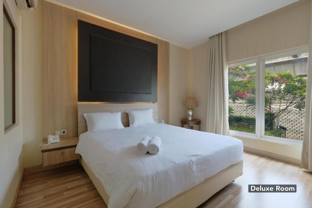 غرفة ديلوكس، Oyo 128 Mutiara Suites 3/6