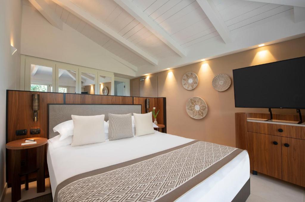 Room at Baia di Chia Resort Sardinia, Curio Collection by Hilton, DOMUS DE MARIA