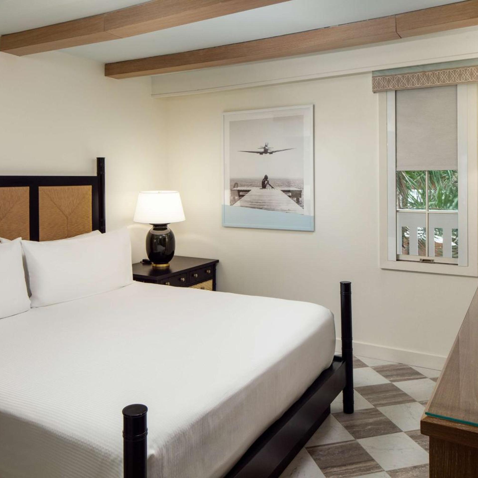 SUITE, KING BED, POOL AND PARTIAL OCEAN VIEW