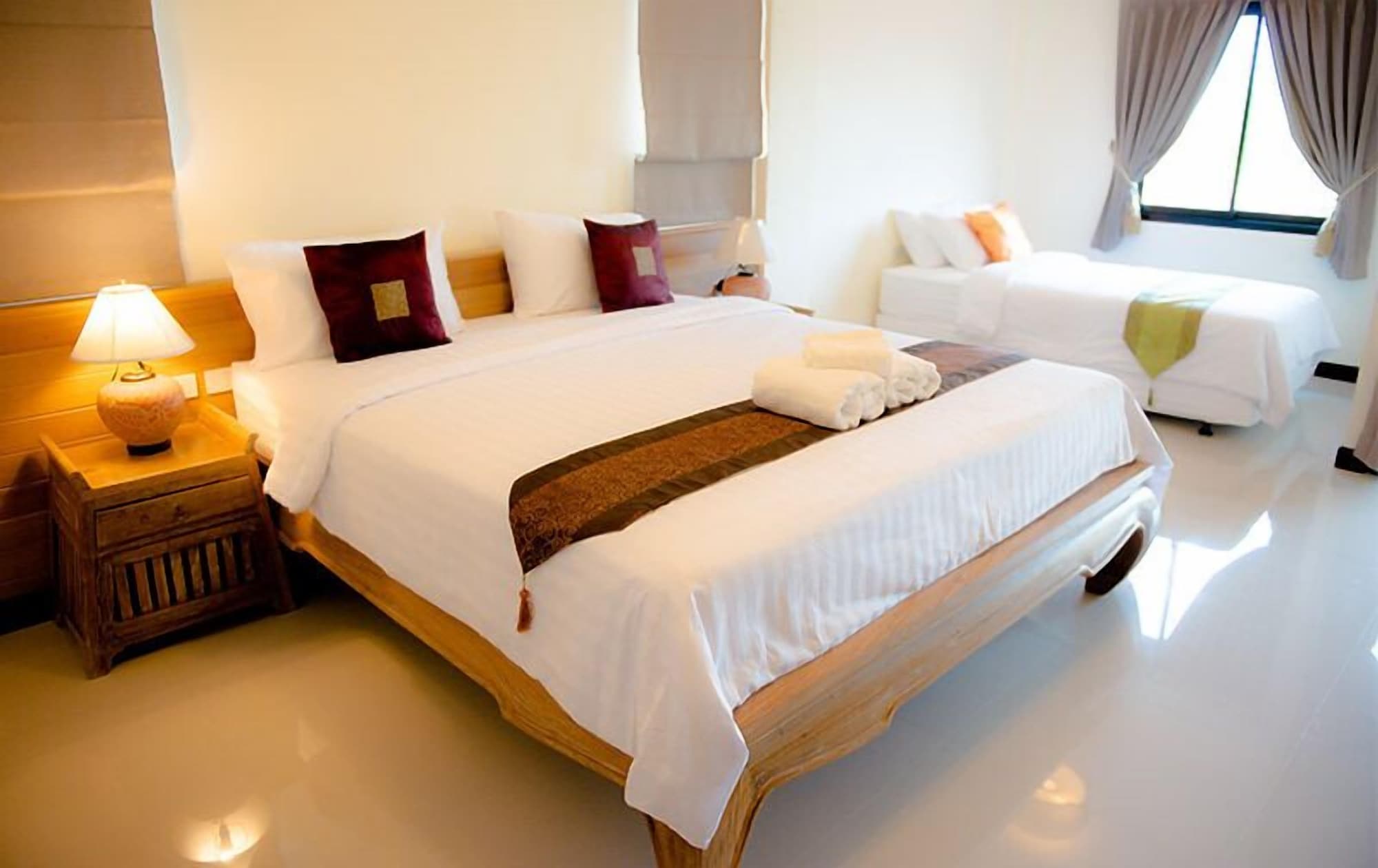 غرفة ديلوكس ثلاثية بسرير مزدوج وسرير فردي، Chivapuri Residence Trat 5/10