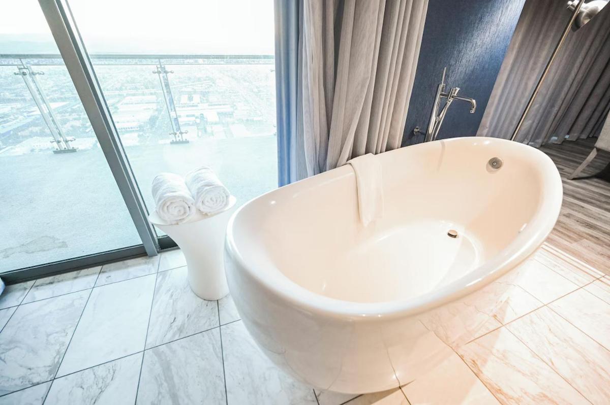1 Bedroom Balcony Collection Living Room & Jet Tub Bath - StripSuite Palms Place Hotel 31/31