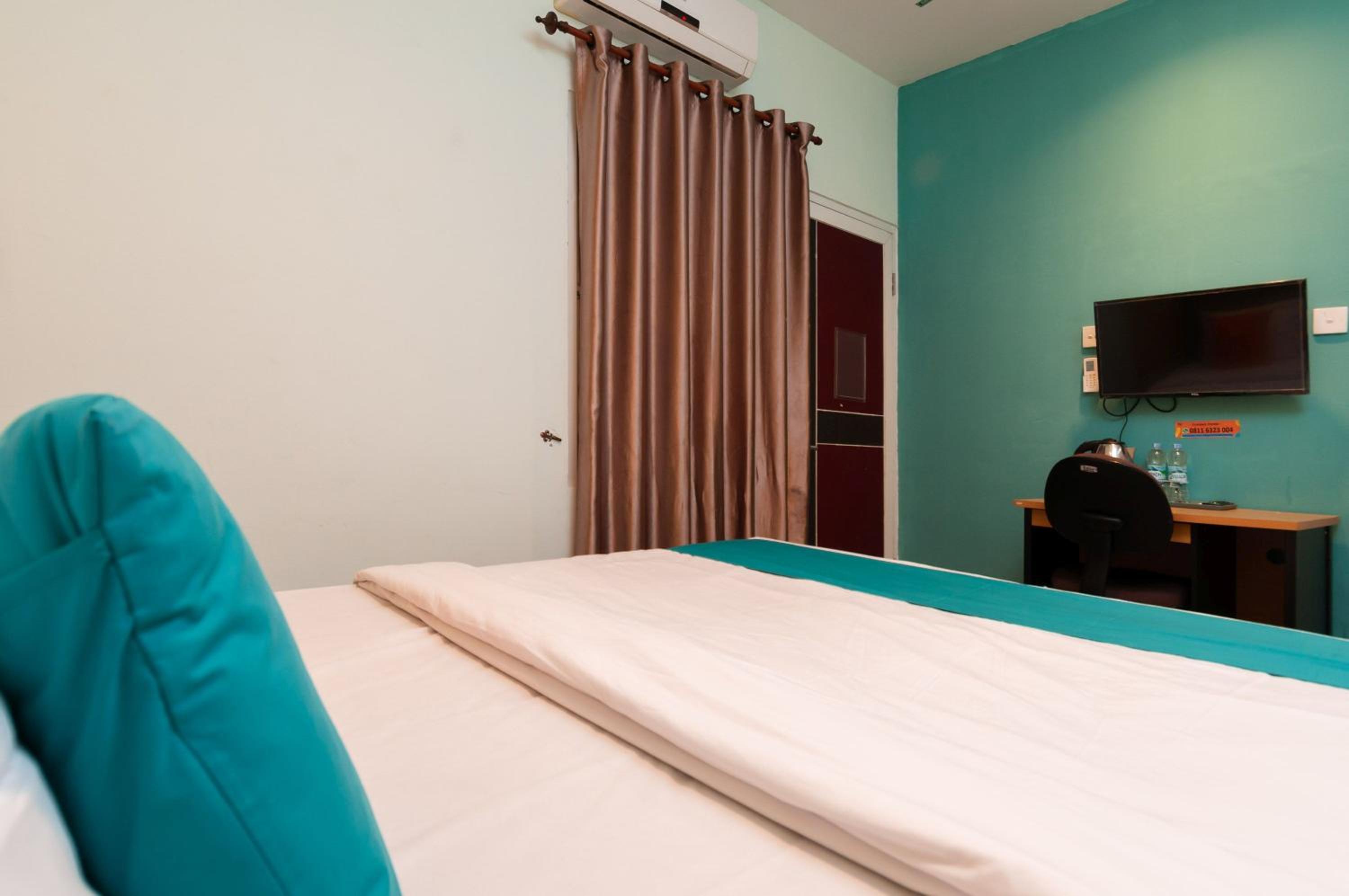 غرفة ديلوكس بسرير مزدوج، Sans Hotel Finest Medan 3/7