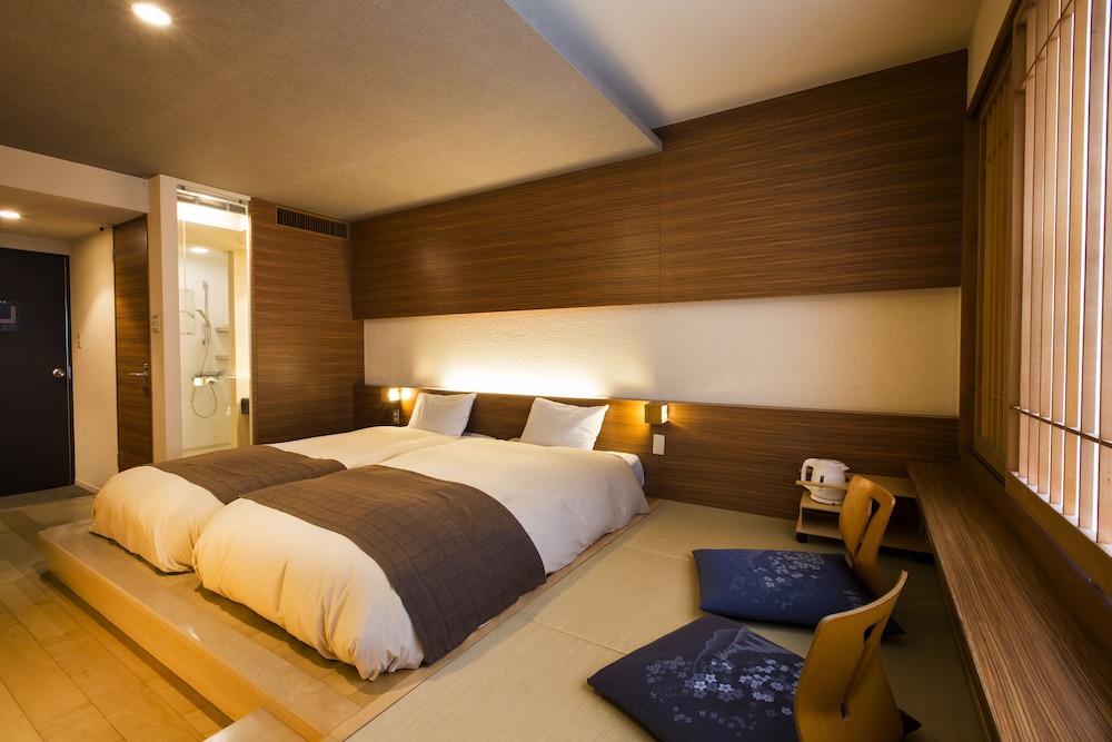 غرفة يابانية بسريرين منفصلين، Sounkyo Onsen Choyo Resort Hotel 2/4