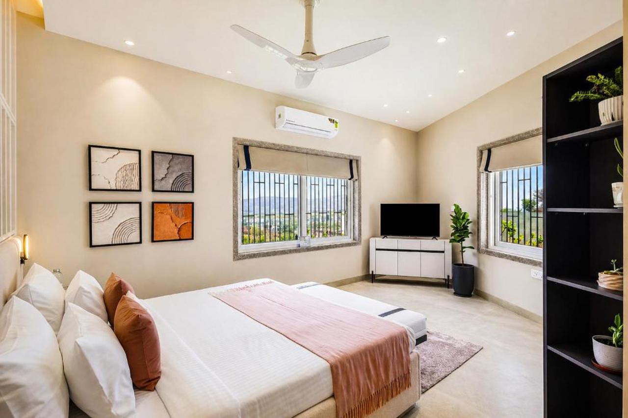 Room at ELIVAAS Shourya Viola 3 BHK Villa with Pvt Pool & Garden, UDAIPUR