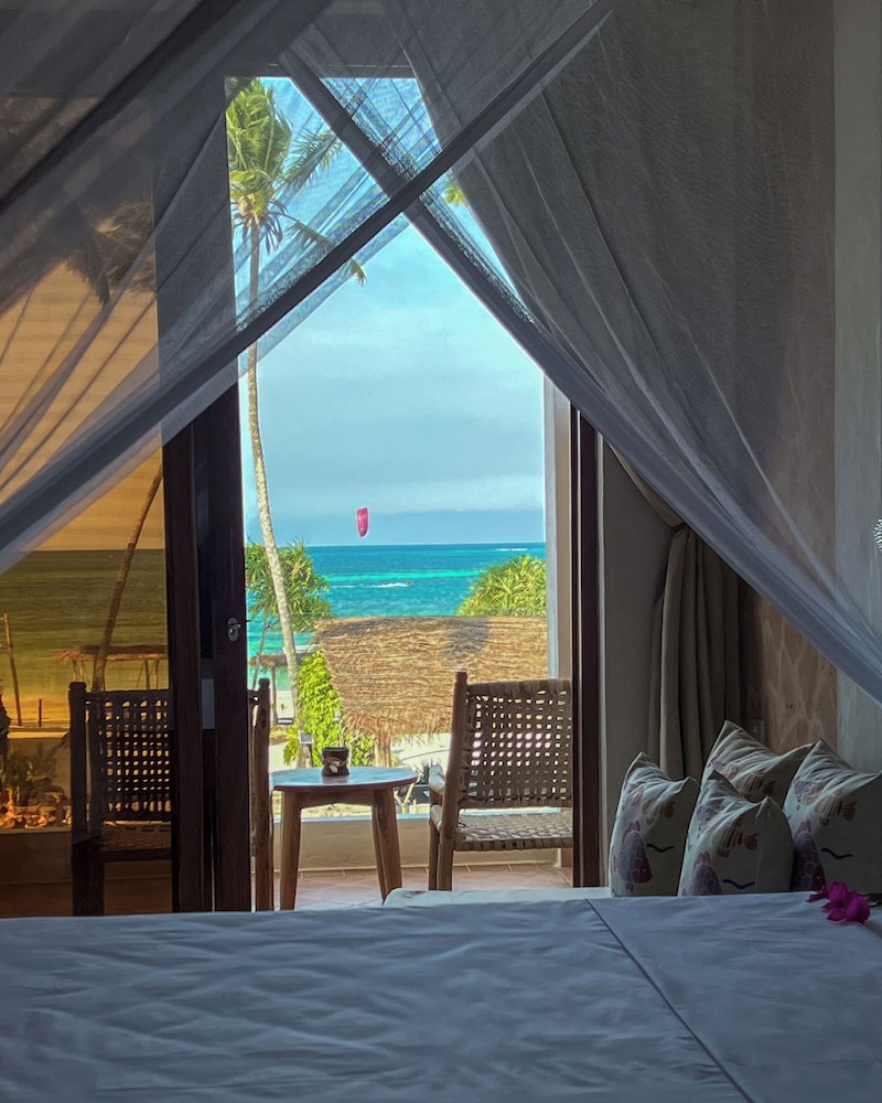 غرفة سيغنتشر ثلاثية بسرير كينج وسرير فردي بإطلالة على البحر، Mvuvi Boutique Resort 4/10