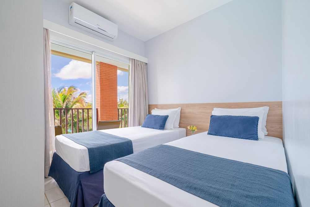جناح ديلوكس بسريرين منفصلين وسرير كينج مع أريكة، Acqua Beach Park Resort 2/10