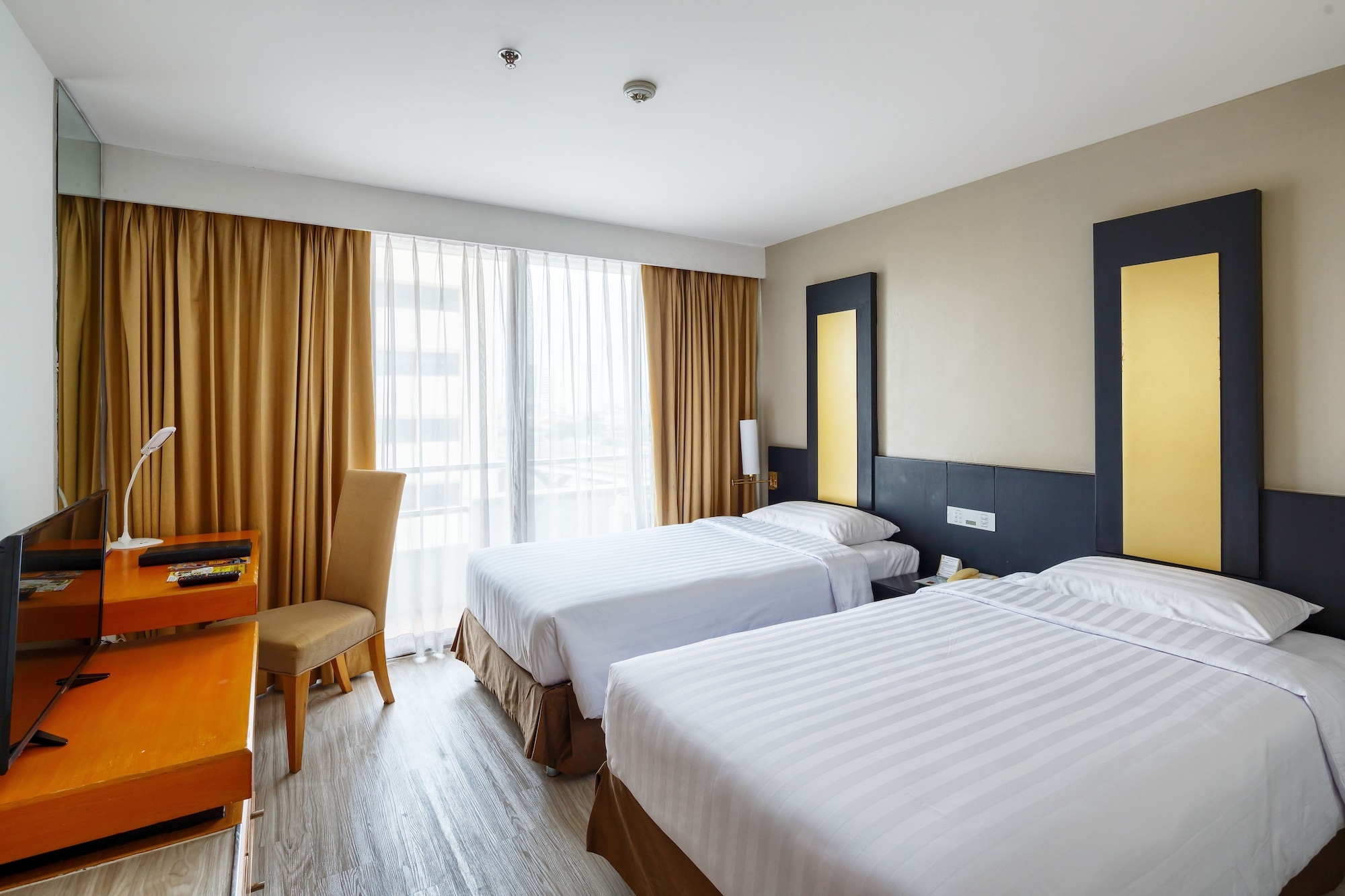 غرفة بريميوم ديلوكس بسرير فردي وسرير كوين