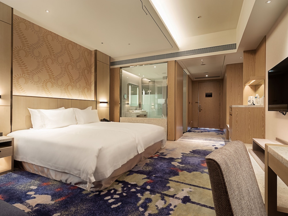 غرفة ديلوكس ثلاثية بسرير كينج وسرير فردي، Fame Hall Garden Hotel 2/4