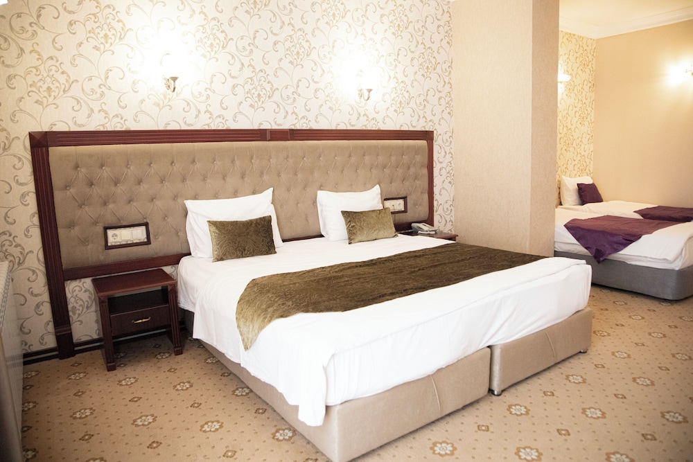 غرفة ديلوكس بسريرين منفصلين، Capitol Hotel 5/6
