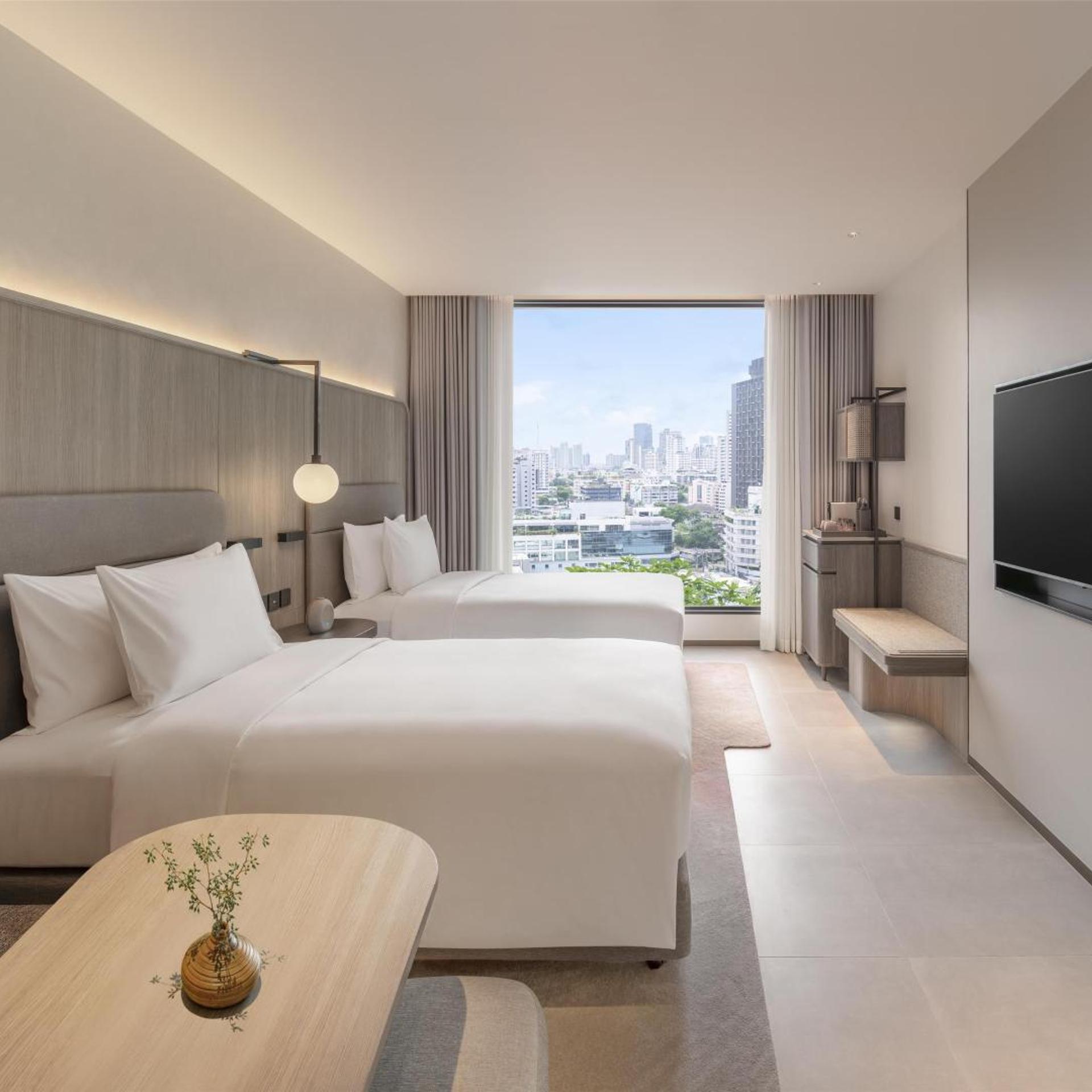 غرفة ركنية بسرير فردي بغرفتي نوم