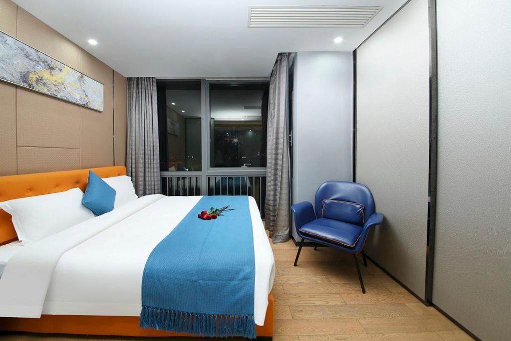 جناح تنفيذي بسرير كينج بغرفة نوم واحدة، Pengman International Apartment Hotel (Beijing Road Jiedeng Duhui) 2/10