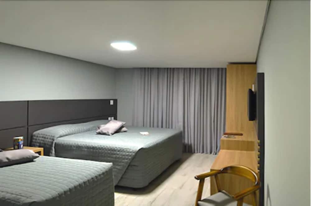 Deluxe, Triple, 1 Double and 1 Single Bed