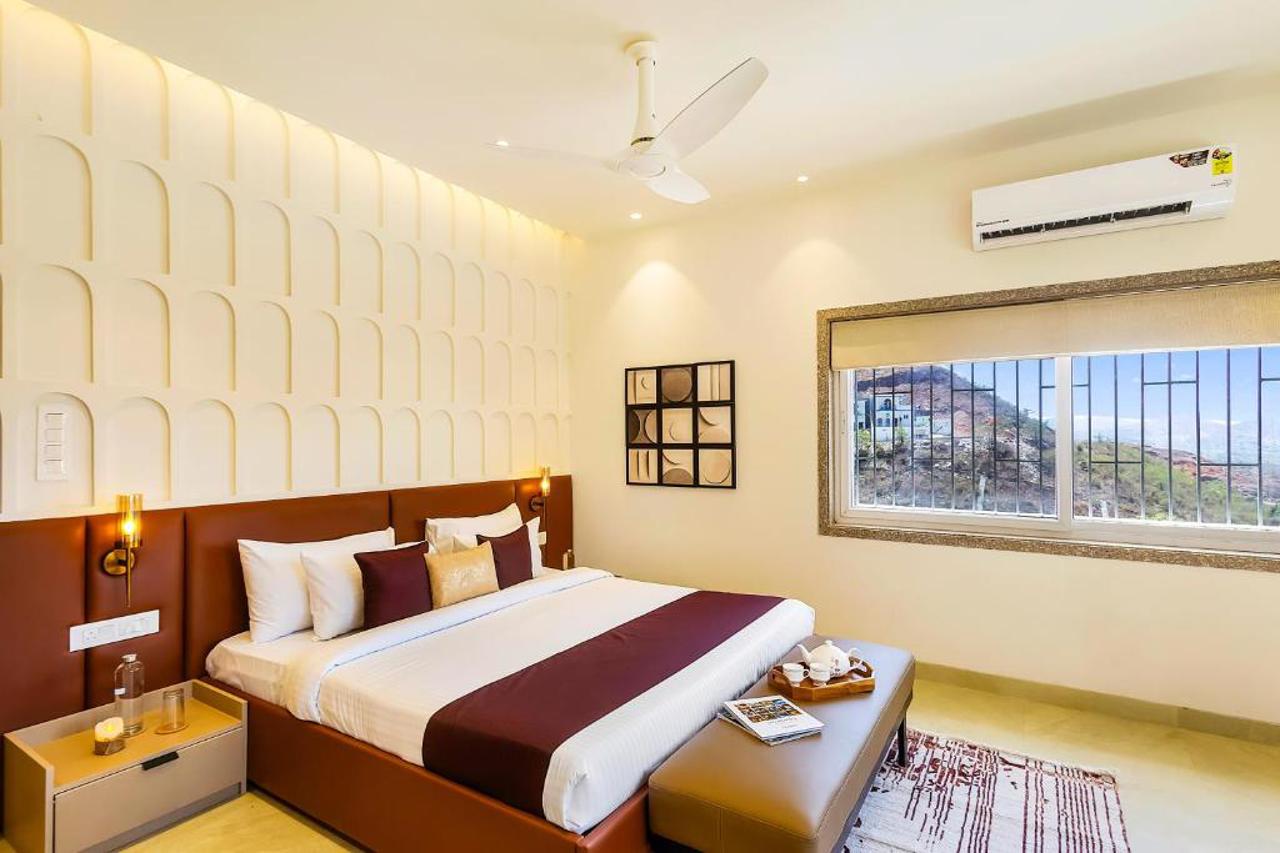 Room at ELIVAAS Shourya Viola 3 BHK Villa with Pvt Pool & Garden, UDAIPUR