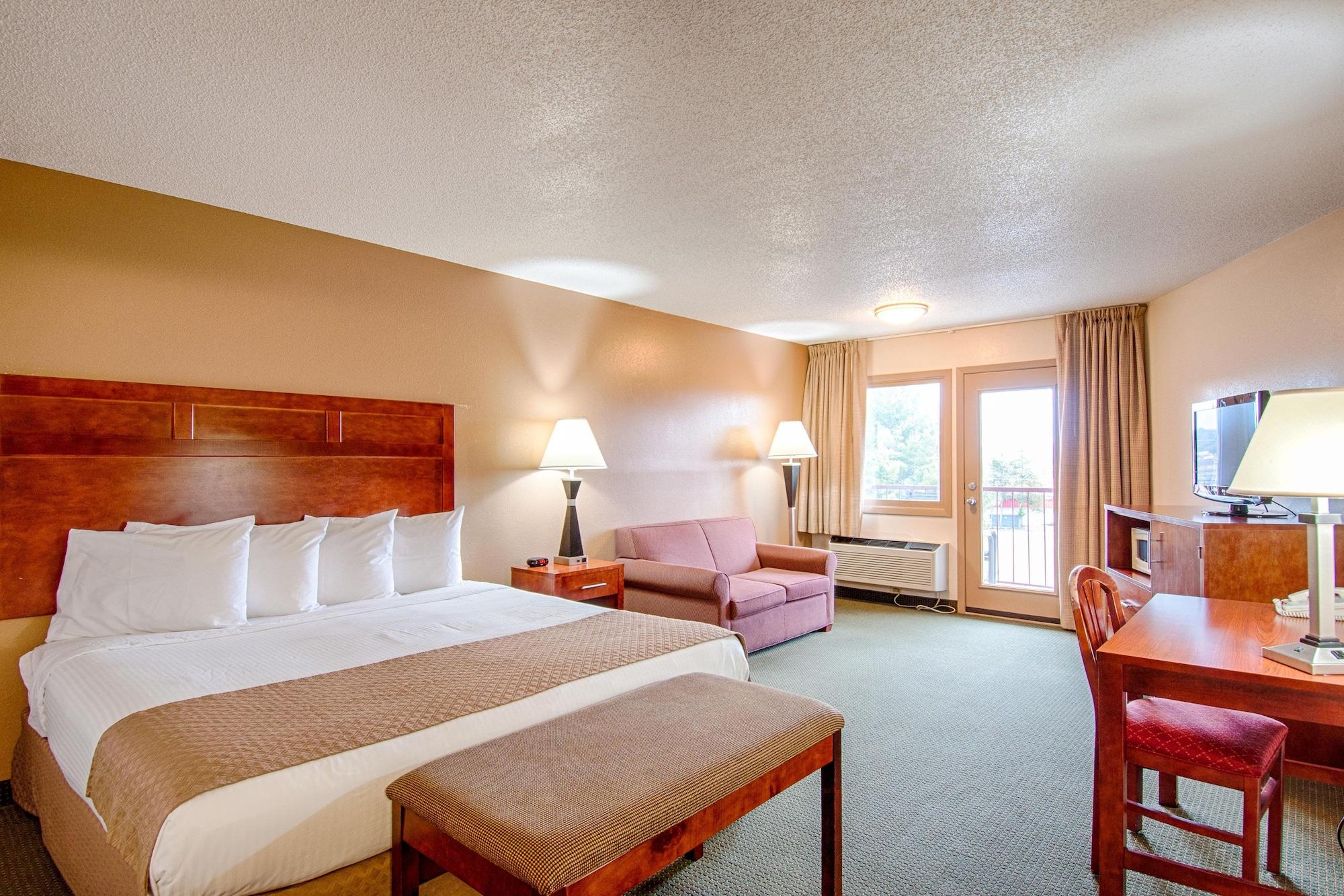 SUITE, 1 KING AND 2 QUEEN BEDS