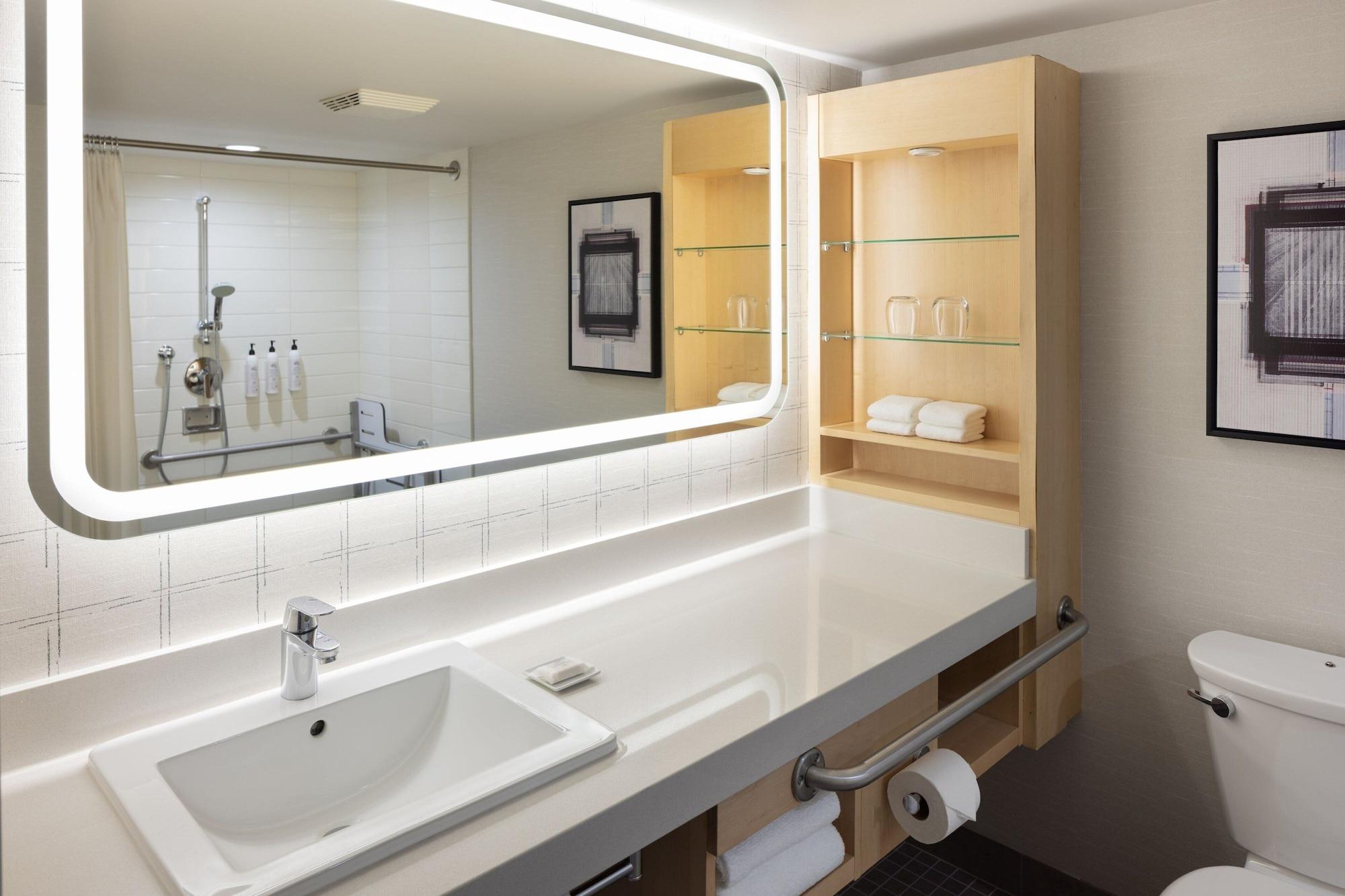 room, multiple beds, city view