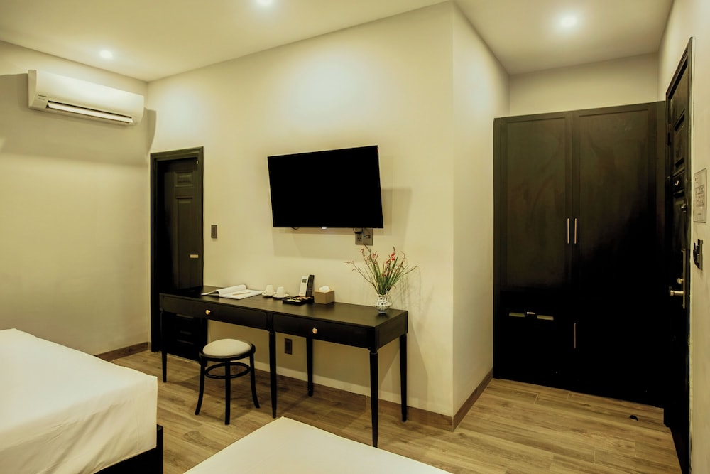 غرفة عائلية ثلاثية بسرير مزدوج وسرير فردي، Anvi Saigon Boutique Hotel 2/4