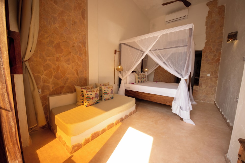 غرفة سيغنتشر ثلاثية بسرير كينج وسرير فردي بإطلالة على البحر، Mvuvi Boutique Resort 6/10