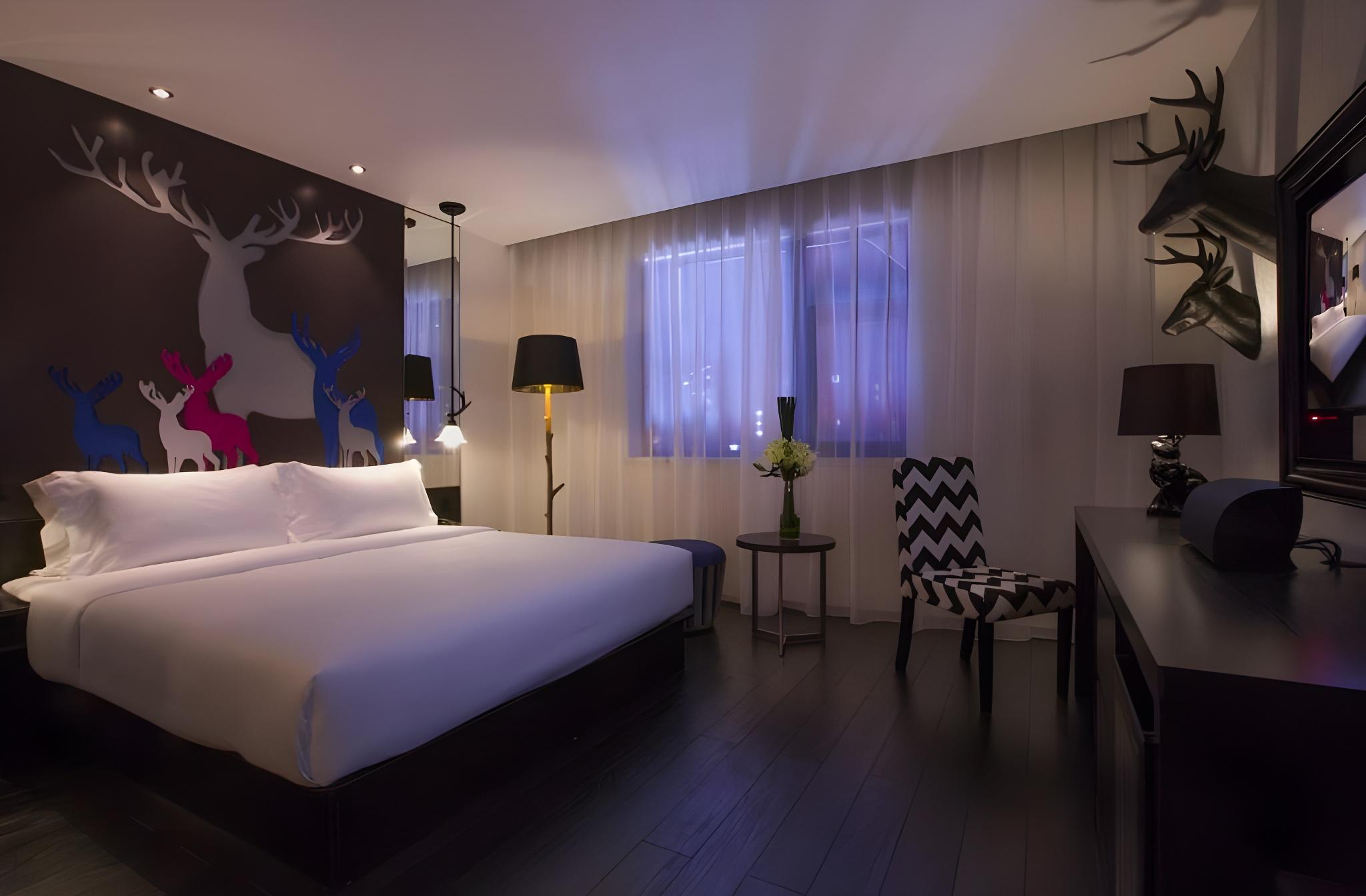 غرفة بسرير كينج وسرير كوين وسرير كوين، Orange Hotel Select Gangding 2/2