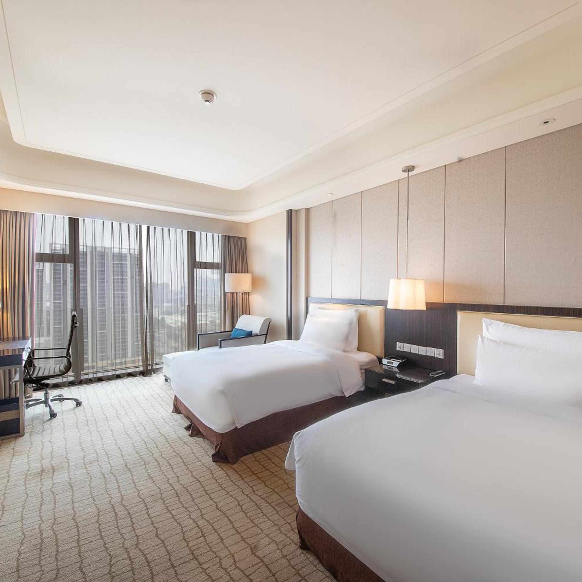 غرفة بسريرين منفصلين بإطلالة على الحديقة، Junluxe Hotel Guangzhou Zengcheng 4/4
