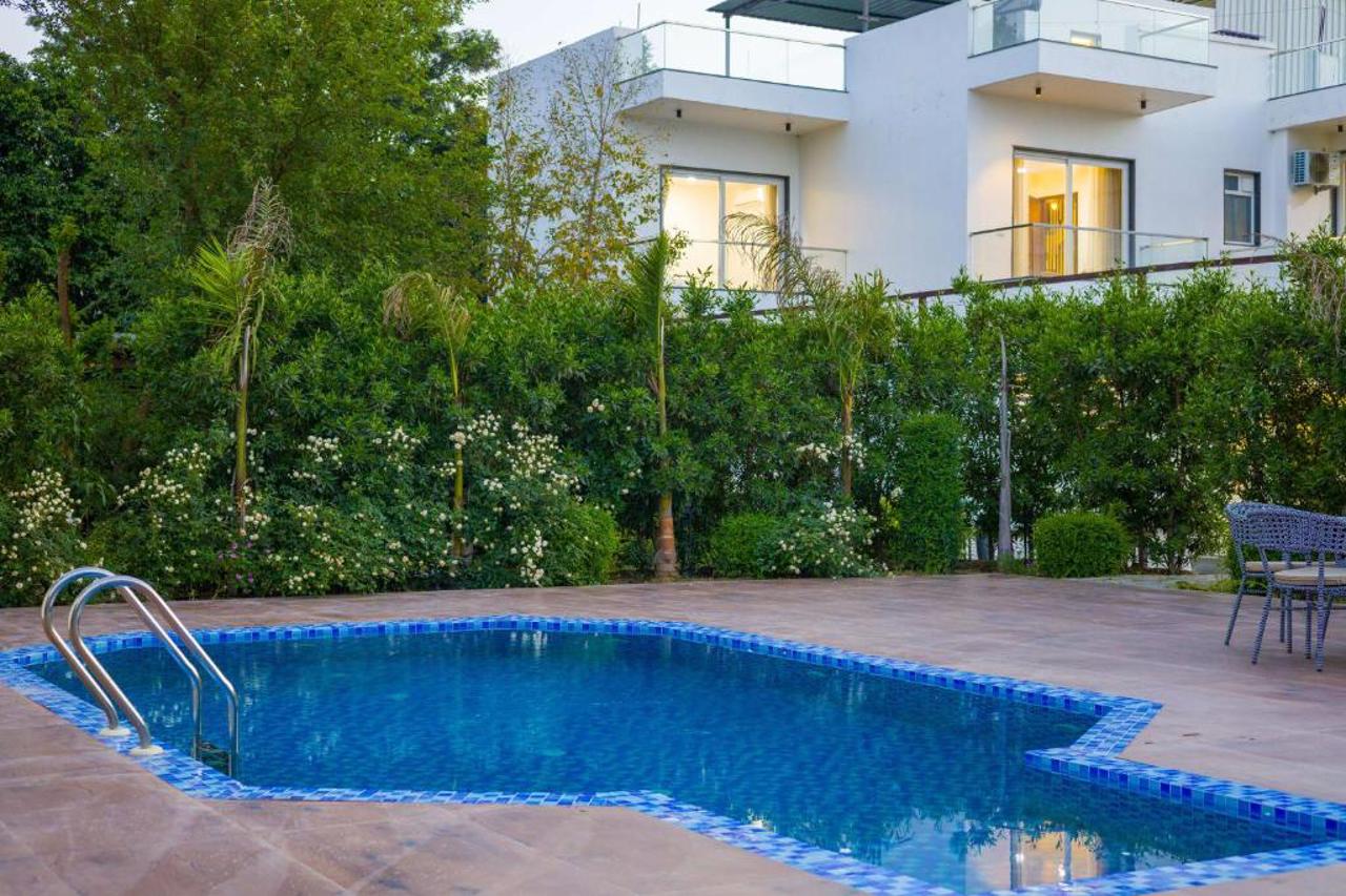 ELIVAAS AdhiVa Retreat 5 BHK Farmhouse with Pvt Pool, Bar & Lush Garden 12/15