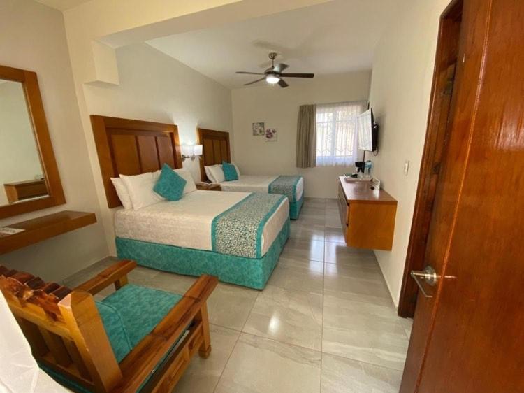 غرفة ديلوكس بسريرين منفصلين، Hotel Quinta las Flores 2/4
