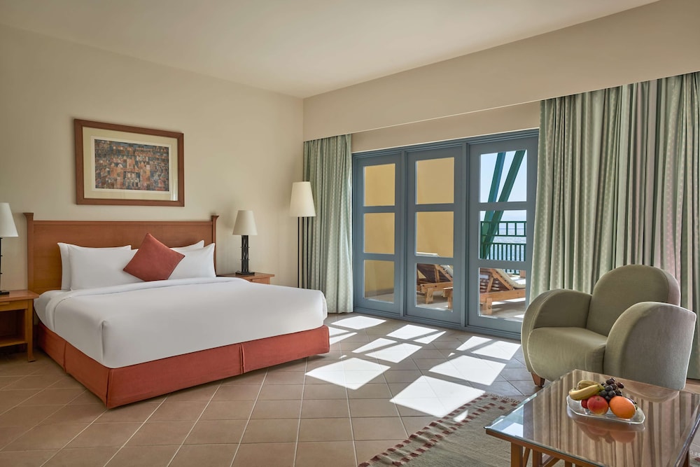 Junior Suite, King Bed, Pool and Sea View