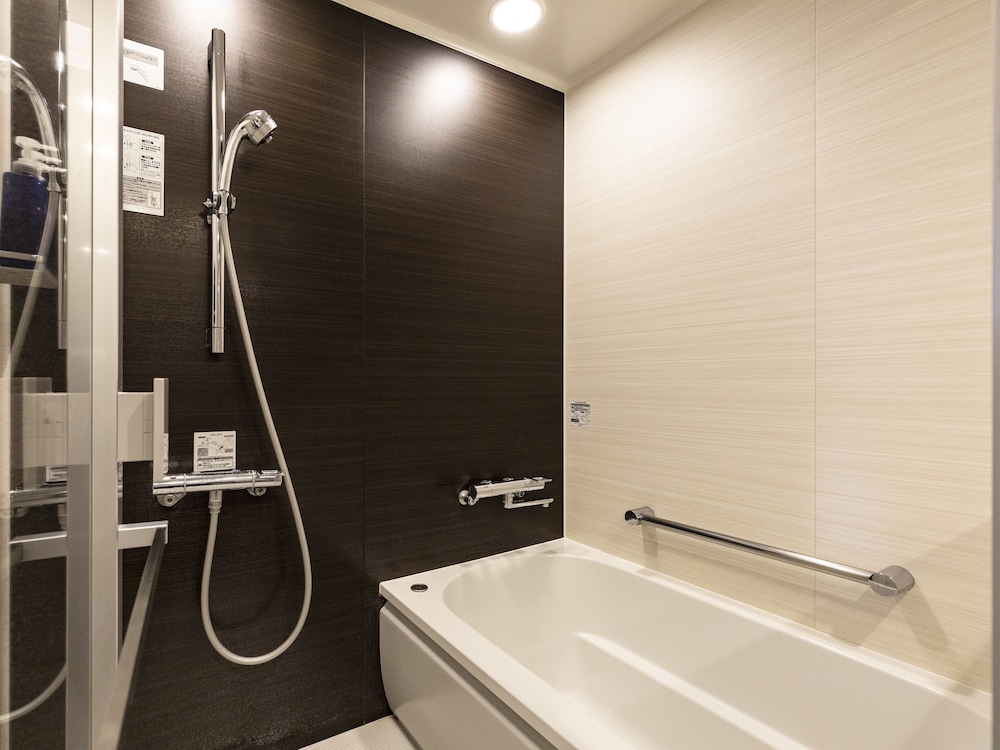 غرفة بسريرين منفصلين، Solaria Nishitetsu Hotel Kagoshima 12/13