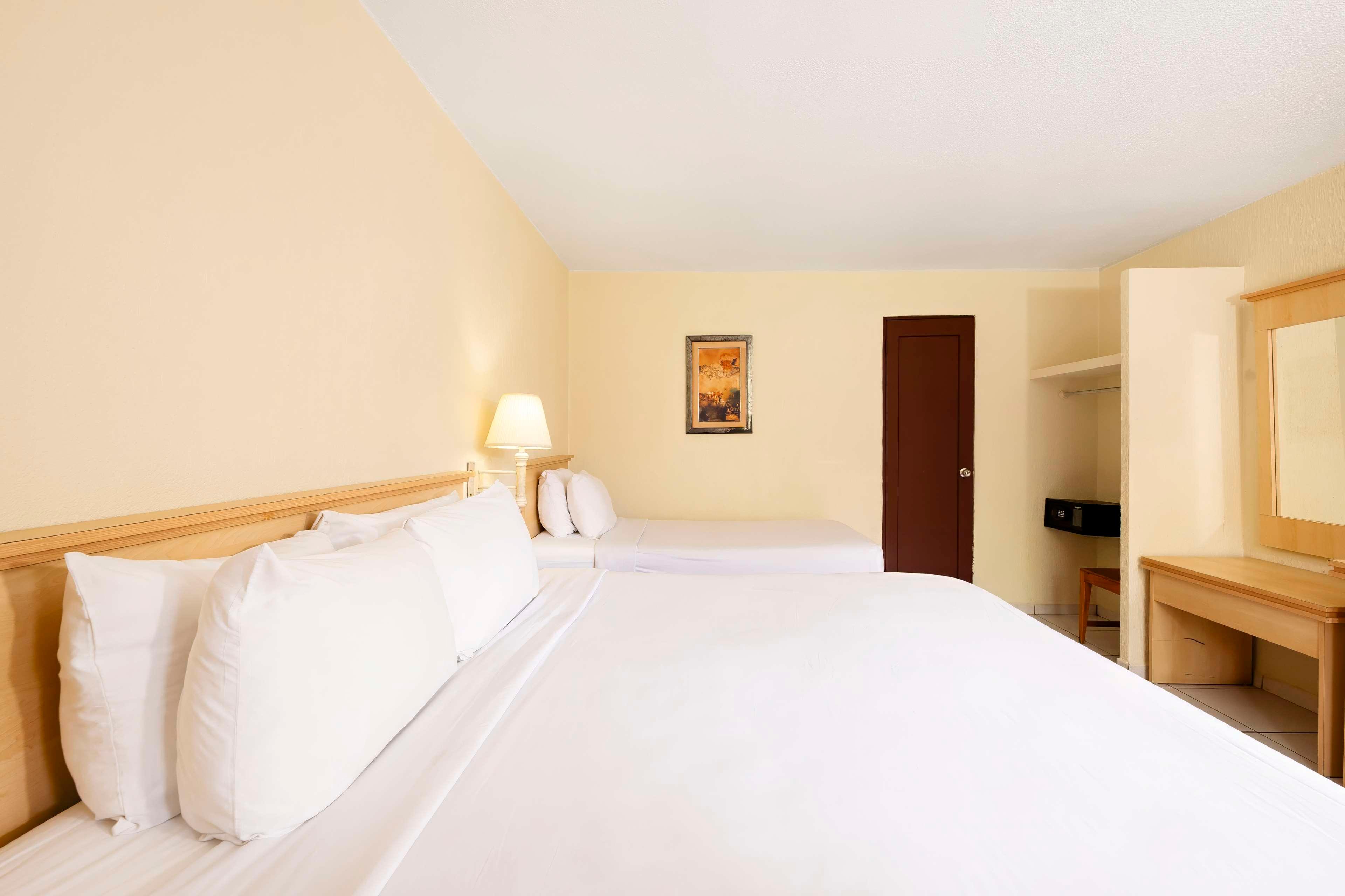 Inner, 1 King and 1 Single Beds, Garden View