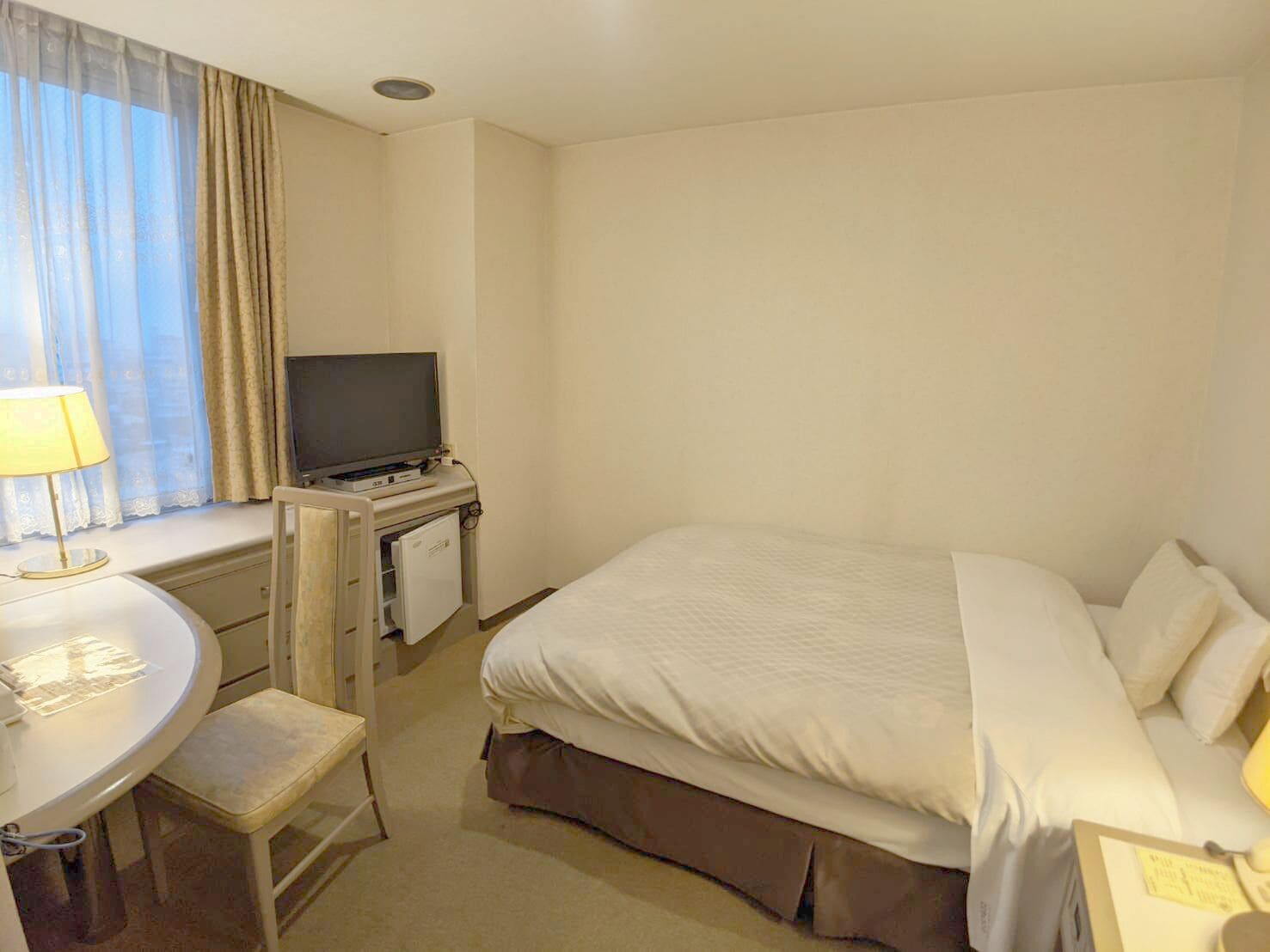 غرفة مفردة، Hotel New Century 11/13